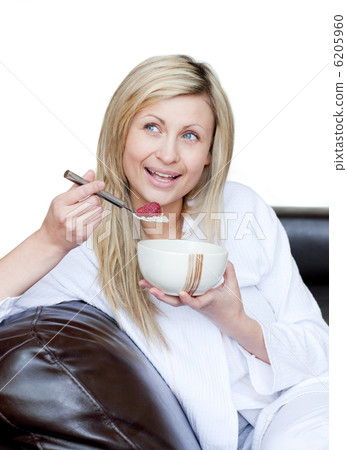Delighted woman having a breakfast 6205960