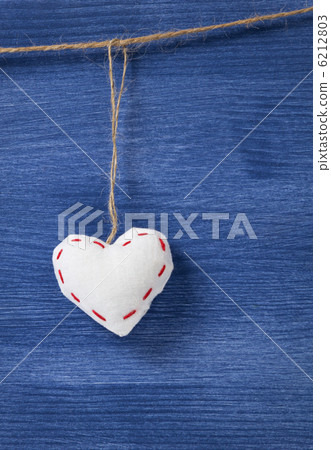 single textile hearts over wooden wall single textile hearts over wooden wall 6212803