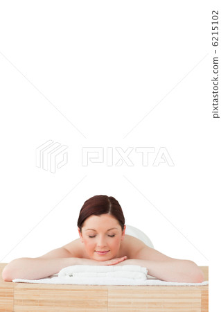 Pretty red-haired woman relaxing in a spa centre Pretty red-haired woman relaxing in a spa centre 6215102