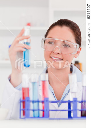 Portrait of a young scientist storing a test tube Portrait of a young scientist storing a test tube 6215507