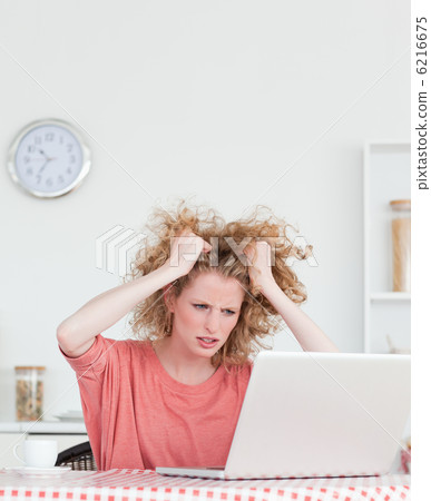 Attractive blonde female being angry while relaxing with her lap 6216675