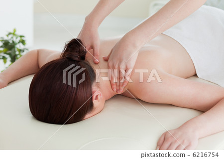 Close up of a young woman having a shoulder massage 6216754
