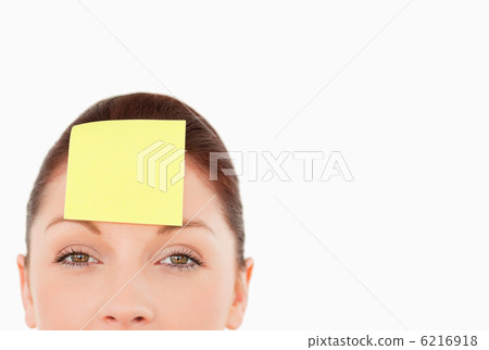 Young woman with a sign on her forehead Young woman with a sign on her forehead 6216918