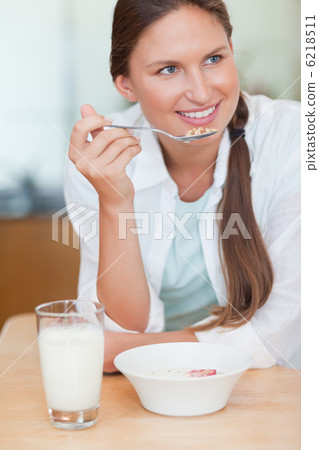 Portrait of a woman having breakfast Portrait of a woman having breakfast 6218511