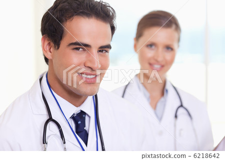 Smiling medical assistants standing next to each other Smiling medical assistants standing next to each other 6218642