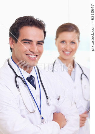 Smiling medical team standing next to each other Smiling medical team standing next to each other 6218647