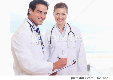 Medical team taking notes Medical team taking notes 6218652