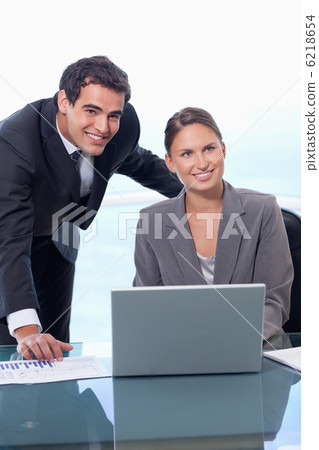 Portrait of a business team with a notebook Portrait of a business team with a notebook 6218654