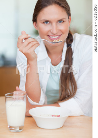 Portrait of a cute woman having breakfast Portrait of a cute woman having breakfast 6219056