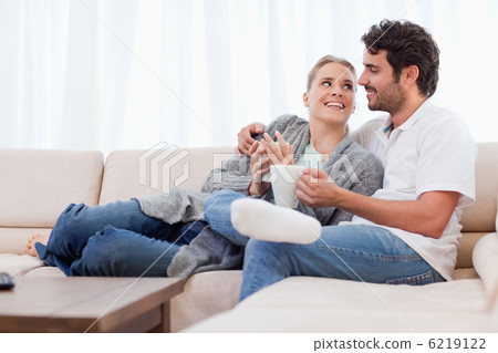 Young couple having a cup of coffee Young couple having a cup of coffee 6219122