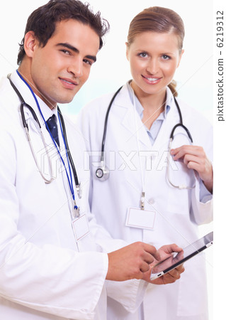 Assistant doctors with tablet Assistant doctors with tablet 6219312