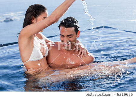 Man holding his playful wife 6219656