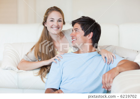 Charming couple watching television Charming couple watching television 6219702