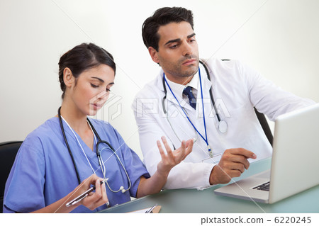 Doctors working with a laptop Doctors working with a laptop 6220245