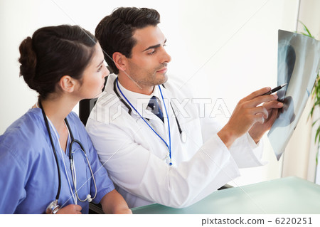 Young doctors looking at a set of X-ray Young doctors looking at a set of X-ray 6220251