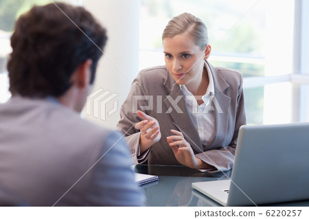 Professional businesswoman receiving a customer Professional businesswoman receiving a customer 6220257
