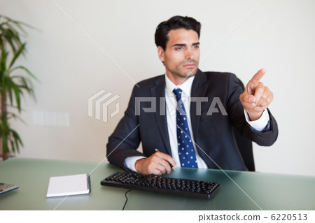 Businessman pointing at something 6220513