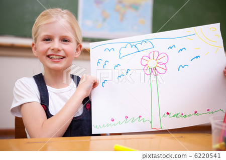Girl showing her drawing 6220541