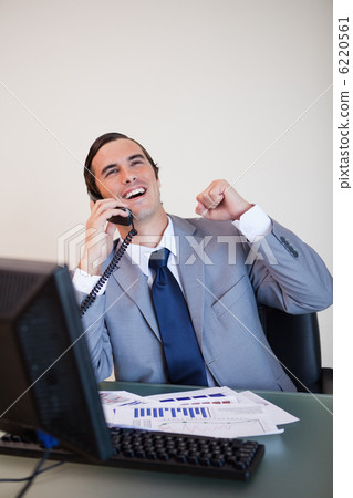 Cheerful businessman on the phone 6220561