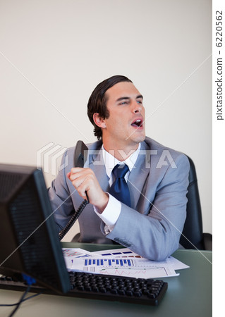 Businessman asking for information his caller needs 6220562