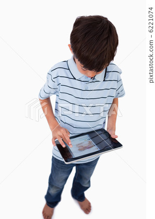 Portrait of a boy using a tablet computer 6221074