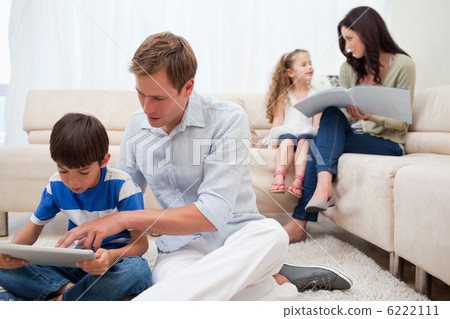 Family spending spare time in the living room 6222111