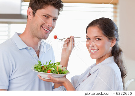 Housewife feeding her husband 6222630