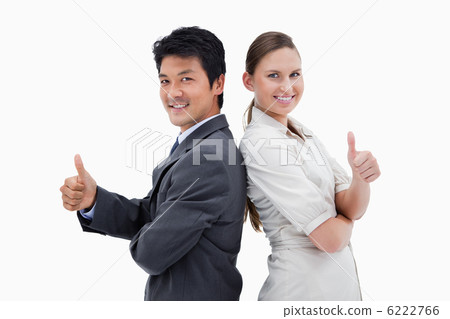 Business people standing back to back with the thumb up 6222766