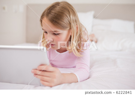 Little girl using a tablet computer 6222841