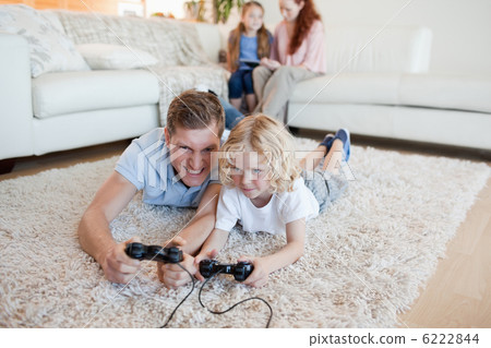 Father and son playing video games Father and son playing video games 6222844