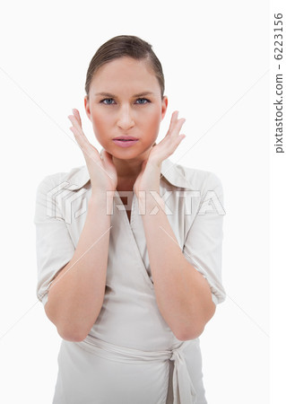 Portrait of a businesswoman with her hands around her face 6223156