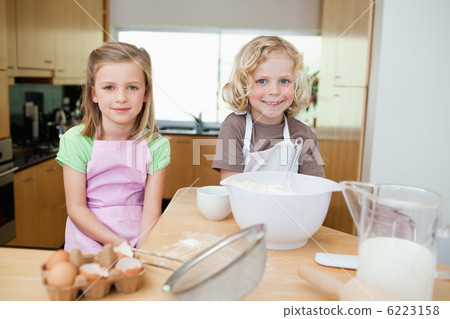 Smiling siblings preparing dough Smiling siblings preparing dough 6223158