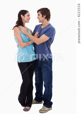 Portrait of a young couple embracing each other 6223318
