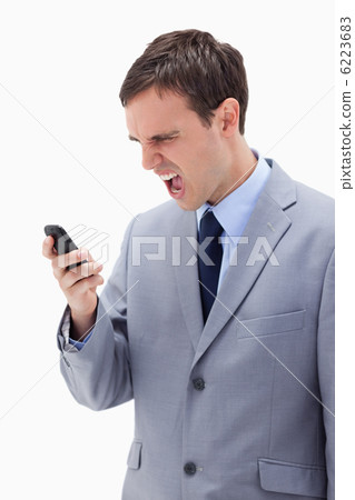 Businessman yelling at his cellphone Businessman yelling at his cellphone 6223683