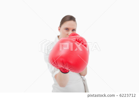 Serious businesswoman boxing Serious businesswoman boxing 6223712