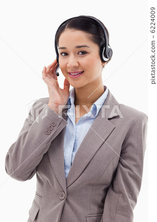 Portrait of a good looking operator posing with a headset 6224009