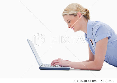 Side view of woman using laptop Side view of woman using laptop 6224290