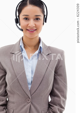 Portrait of a brunette operator posing with a headset 6224309
