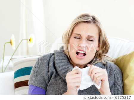 Young woman sneezes Young woman sneezes 6225217