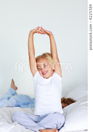 Beautiful young child stretching Beautiful young child stretching 6225384