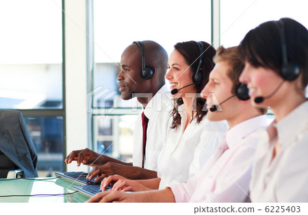 Portrait of a concentrated sale representative team at work Portrait of a concentrated sale representative team at work 6225403