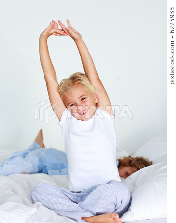 Smiling girl stretching Smiling girl stretching 6225933