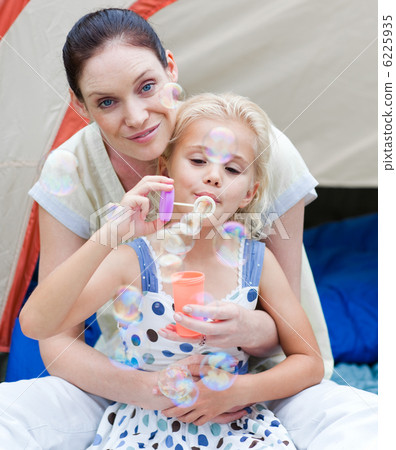 Handsome mother with he daughter and air blowing 6225935