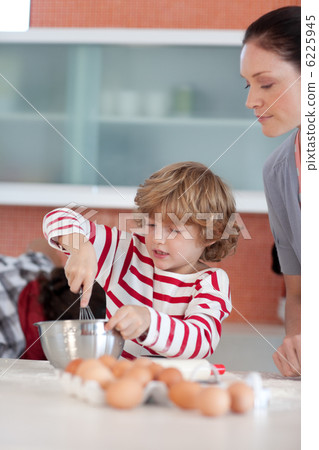 Little boy working in the kitchen Little boy working in the kitchen 6225945