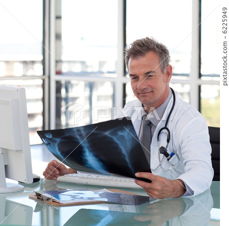 Handsome senior doctor with x-ray 6225949