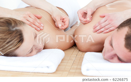 Relaxed couple in an acupuncture therapy 6226875