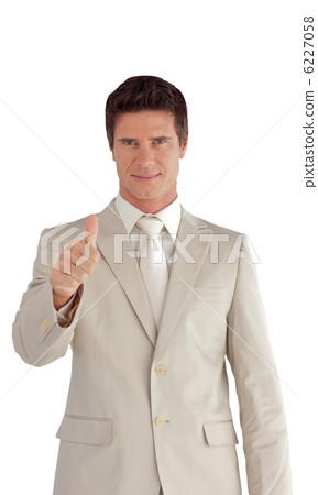 Confident businessman making a thumb-up Confident businessman making a thumb-up 6227058