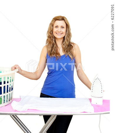 Beautiful woman behind an ironing board 6227091