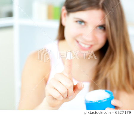 Pretty woman with cosmetic cream 6227179