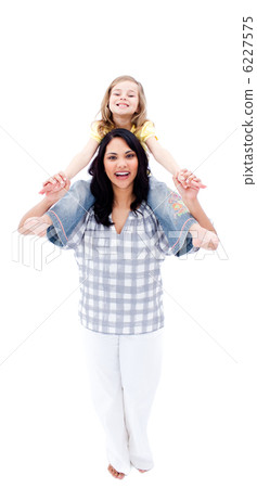 Joyful mother giving her daughter piggyback ride 6227575